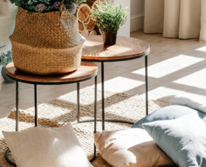 Interior of bright living room in scandinavian eco style with coffee table and pillows