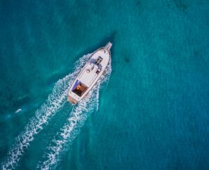 Vintage wooden boat in coral sea. Vintage boat. Vintage Yacht.