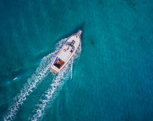 Vintage wooden boat in coral sea. Vintage boat. Vintage Yacht.