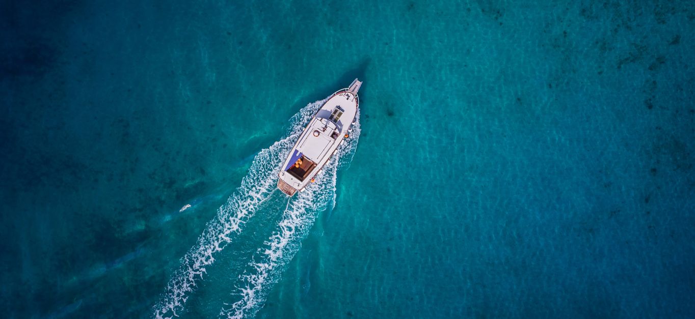 Vintage wooden boat in coral sea. Vintage boat. Vintage Yacht.