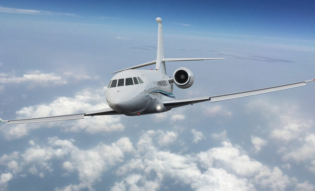 Frontal view of a private jet flying