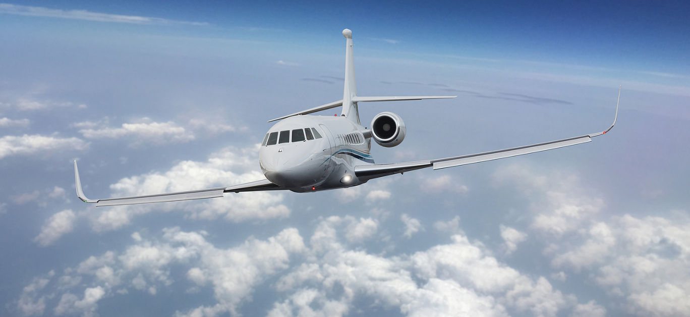 Frontal view of a private jet flying