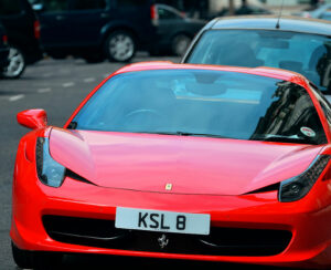 Red porsche and London Street view on September 27, 2013 in London, UK