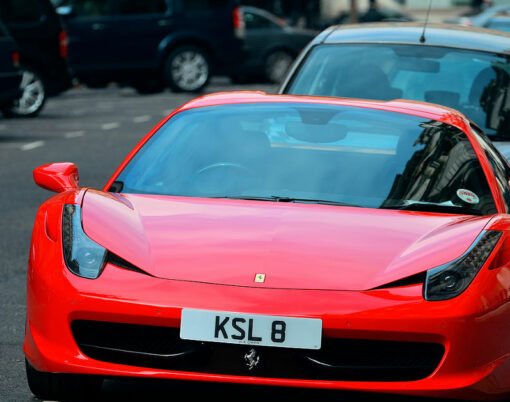 Red porsche and London Street view on September 27, 2013 in London, UK