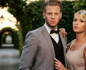 Well-dressed couple in a beautiful alley